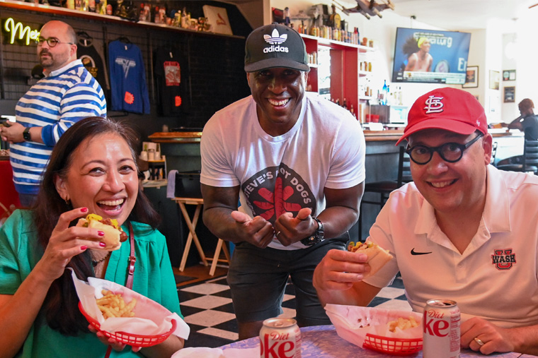 Anna Gonzalez and Chancellor Andrew D. Martin met Steve Ewing, owner of Steve’s Hot Dogs.