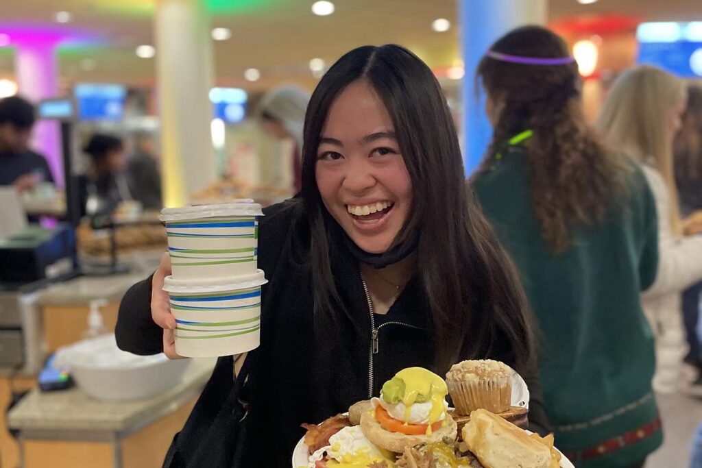 Student with plates of food