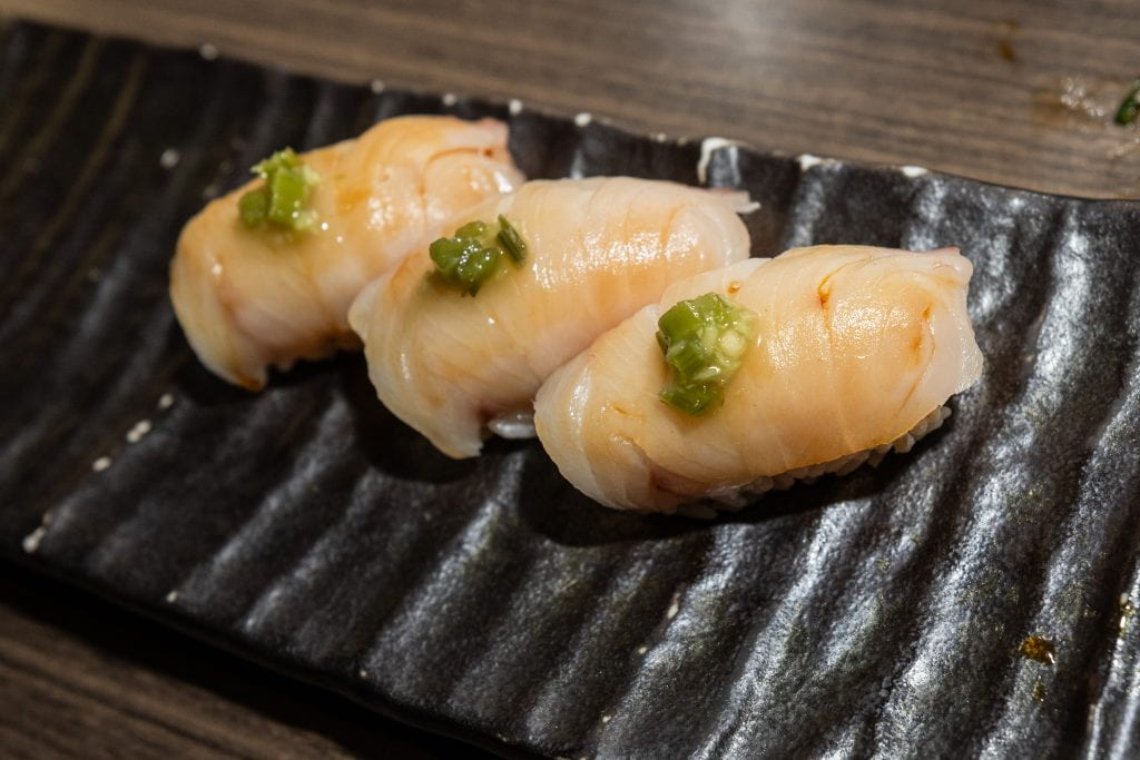 Hamachi Nigiri: yellowtail with Japanese green onion sauce