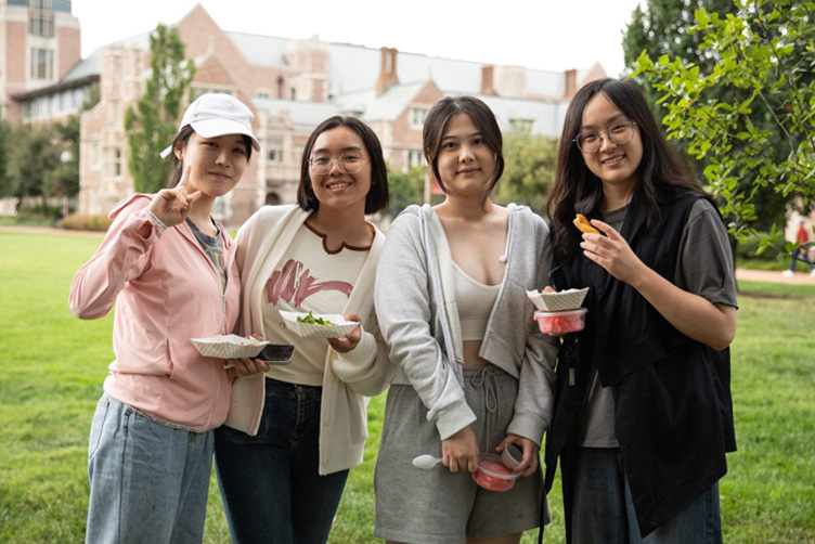 Four students pose for a photo. 