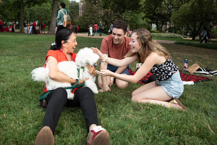 Dr. G with students and her dog. 