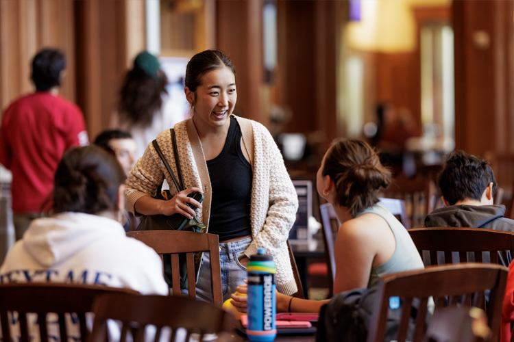 Students chatting at a table