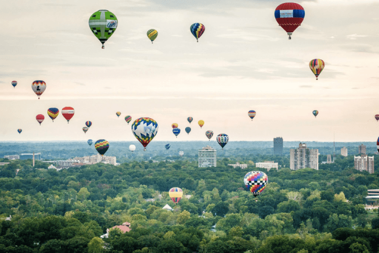 hot air balloons over a city