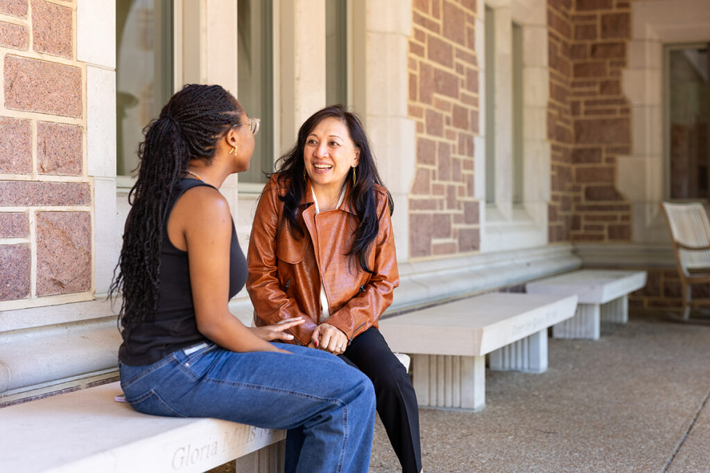 Dr. G speaking with a student