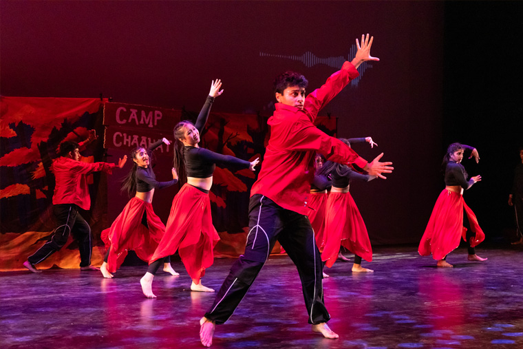 Group of students performing on stage during Diwali event