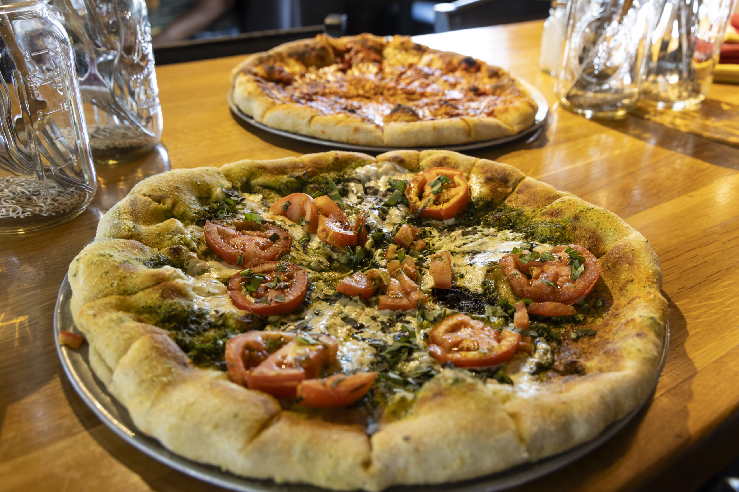 Two pizzas on a table