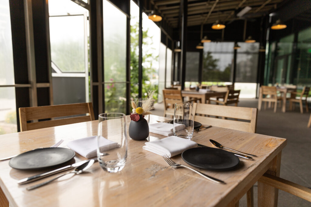 A dining table with setting.