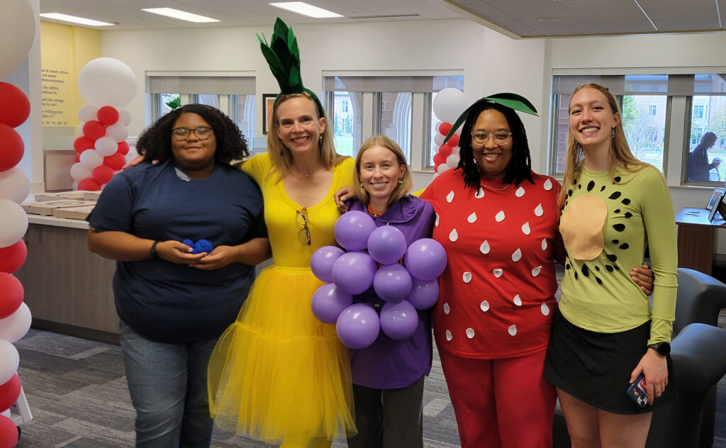 Student and staff pose for Student Affairs Halloween costume contest