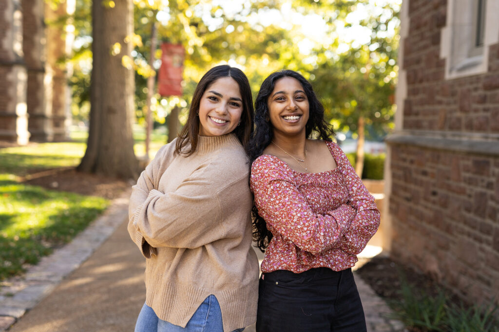 Natalia Ramos and Rishika Jeyaprakash pose for a photo.