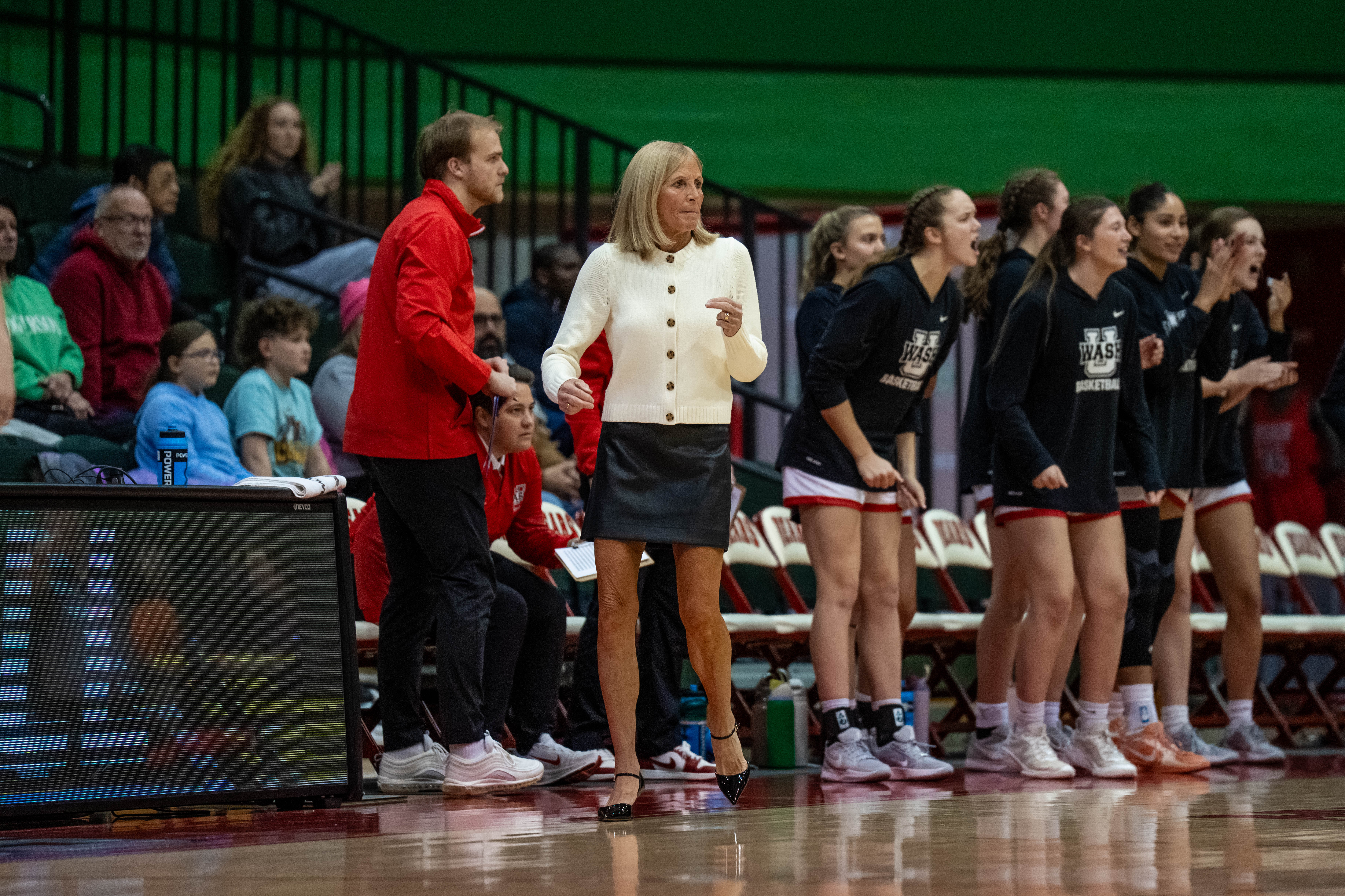Energetic coach leads WashU women’s basketball toward postseason
