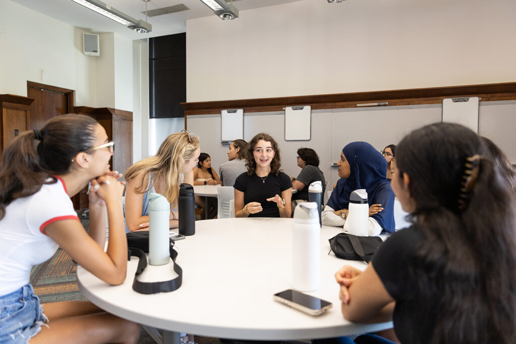 Students talking around a table