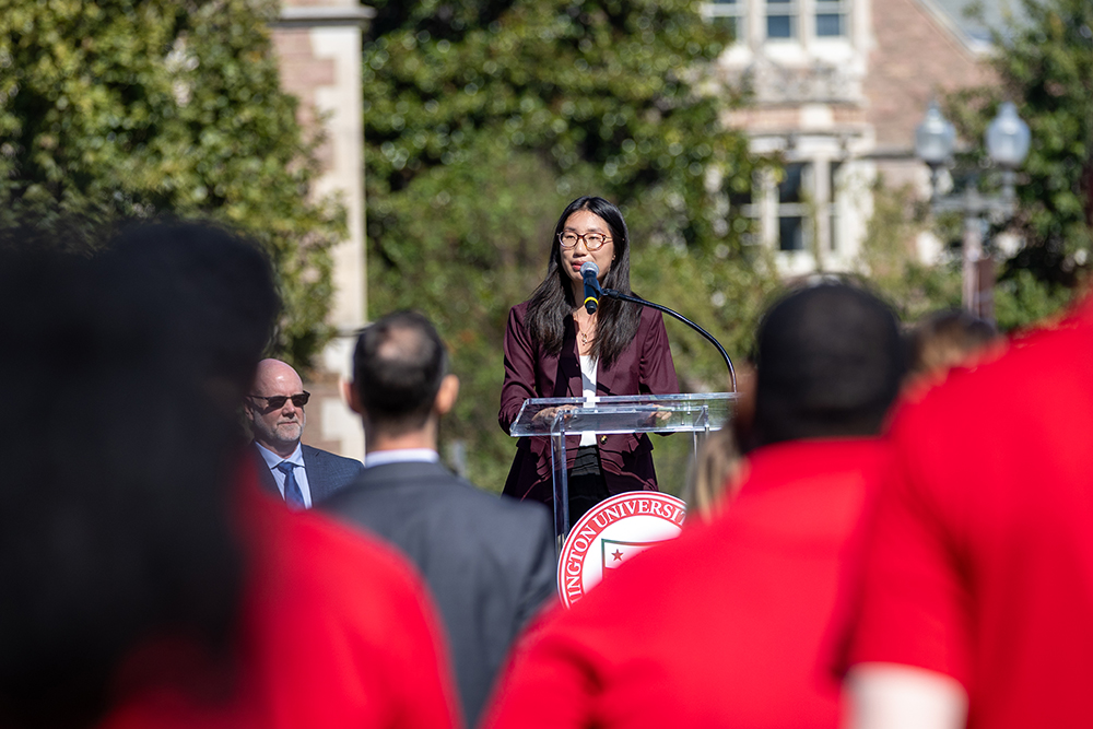 Student Meishu Han addresses the crowd.